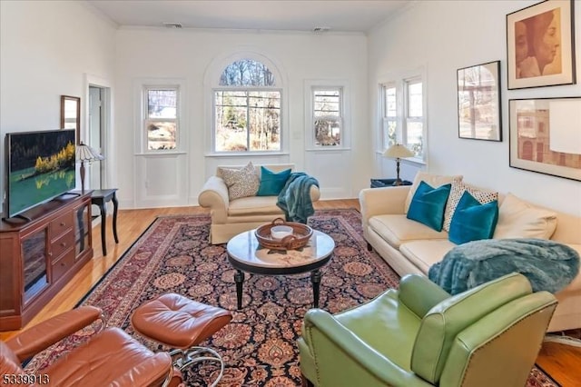 living room featuring visible vents and wood finished floors