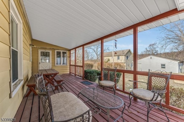 sunroom with lofted ceiling