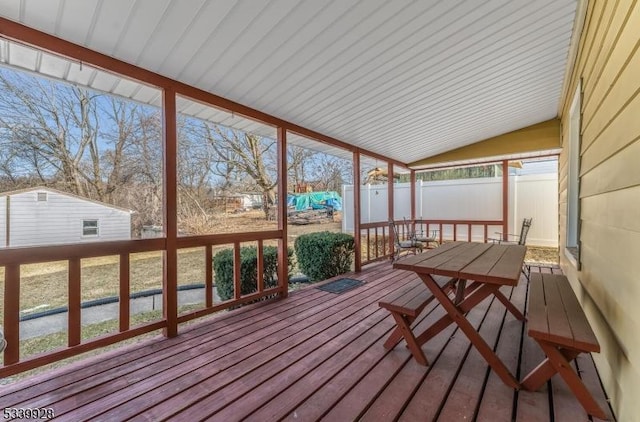 sunroom / solarium with vaulted ceiling