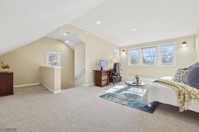 bedroom with carpet floors, vaulted ceiling, and baseboards