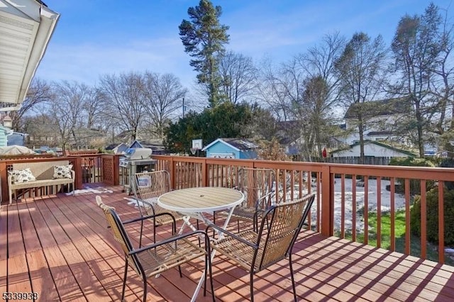 deck featuring outdoor dining area