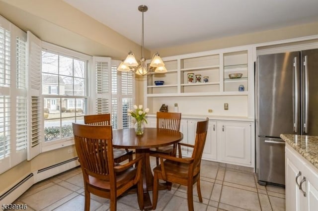 dining area featuring an inviting chandelier, a baseboard radiator, and light tile patterned flooring