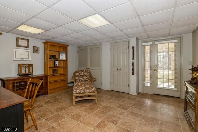 interior space with a drop ceiling