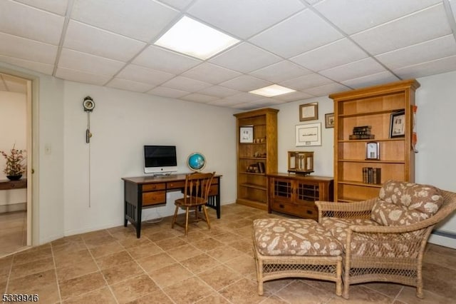 office area featuring a paneled ceiling