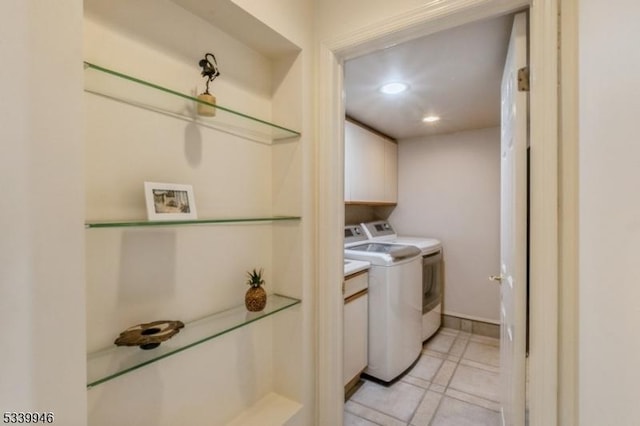 laundry room featuring baseboards, independent washer and dryer, and recessed lighting