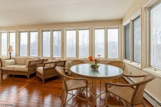 sunroom / solarium featuring baseboard heating