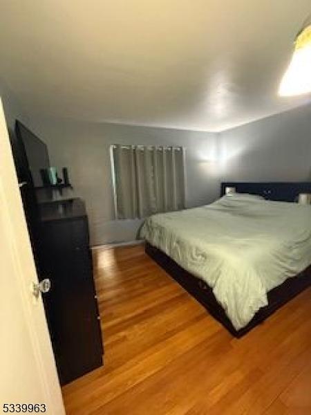 bedroom featuring wood finished floors