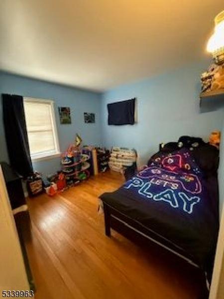 bedroom with wood finished floors