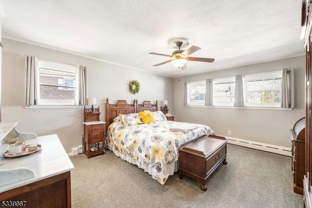 bedroom with a baseboard radiator, light carpet, ceiling fan, and baseboards