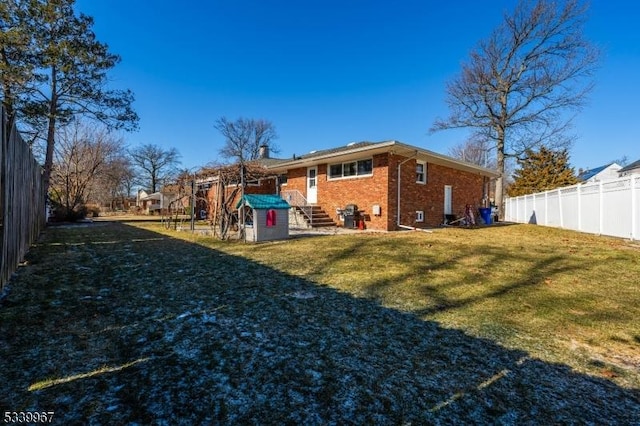 view of yard with a fenced backyard