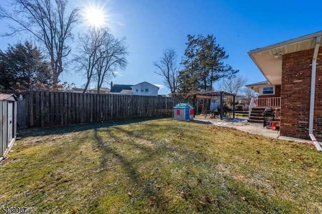 view of yard featuring a fenced backyard and a pergola