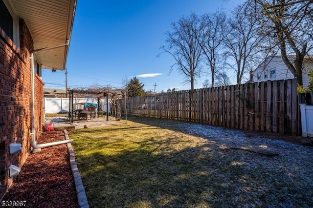 view of yard with a fenced backyard