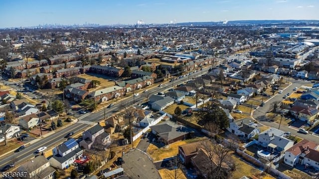 birds eye view of property with a residential view