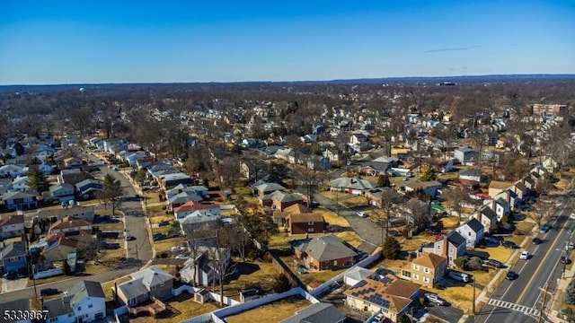 birds eye view of property with a residential view