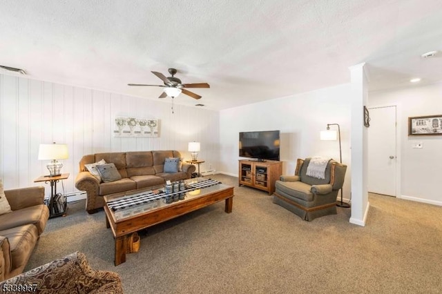 carpeted living area with visible vents, a baseboard heating unit, ceiling fan, a textured ceiling, and baseboards