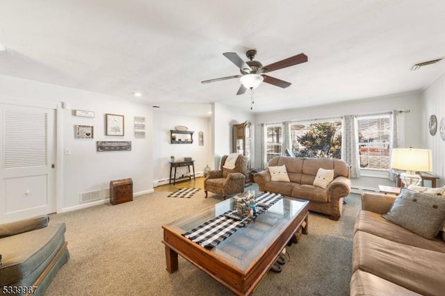 living area featuring a ceiling fan, light colored carpet, visible vents, and baseboards