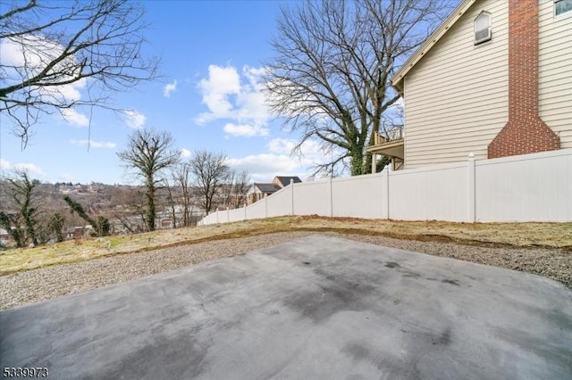 view of yard with fence and a patio