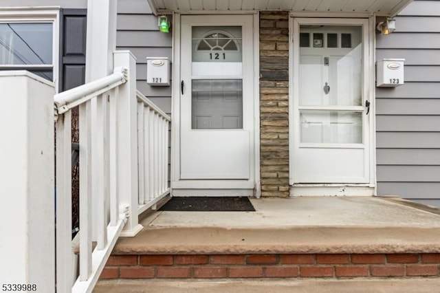 view of exterior entry featuring stone siding