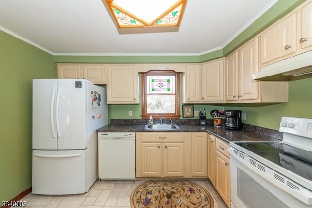 kitchen with white appliances, dark countertops, a sink, under cabinet range hood, and crown molding