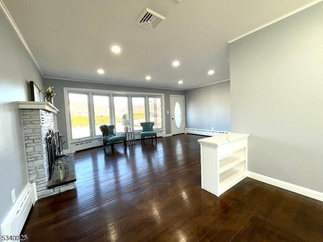 unfurnished living room featuring ornamental molding, a baseboard radiator, and visible vents