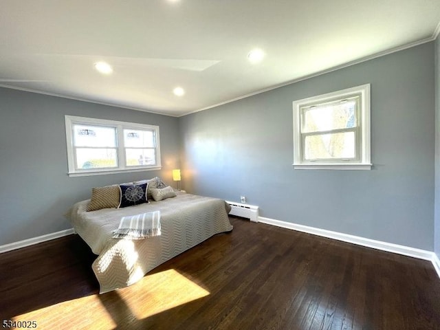 bedroom with a baseboard radiator, baseboards, and ornamental molding