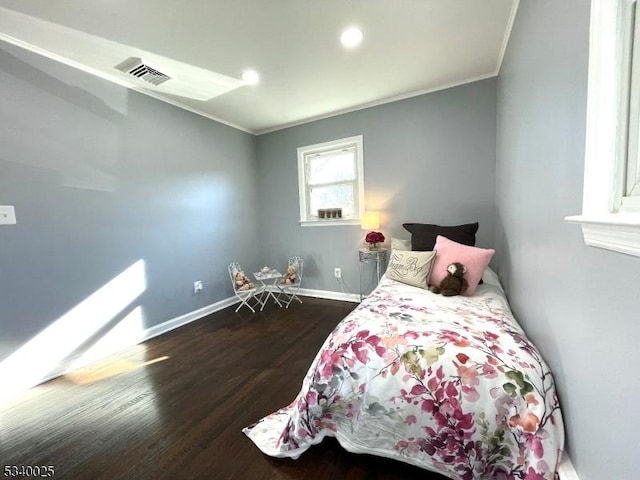 bedroom with recessed lighting, wood finished floors, visible vents, baseboards, and crown molding