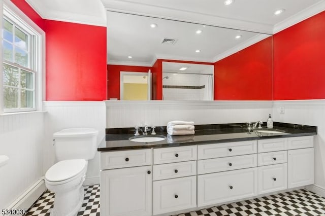 full bathroom featuring wainscoting, visible vents, baseboard heating, and a sink