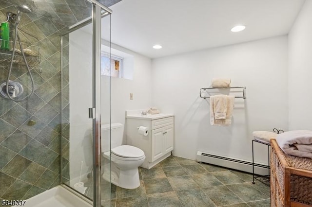 bathroom with toilet, recessed lighting, a stall shower, and baseboard heating