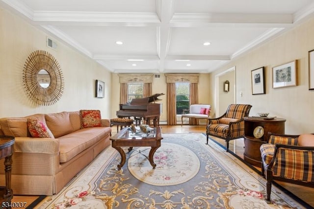 living area with visible vents, ornamental molding, beam ceiling, wood finished floors, and coffered ceiling