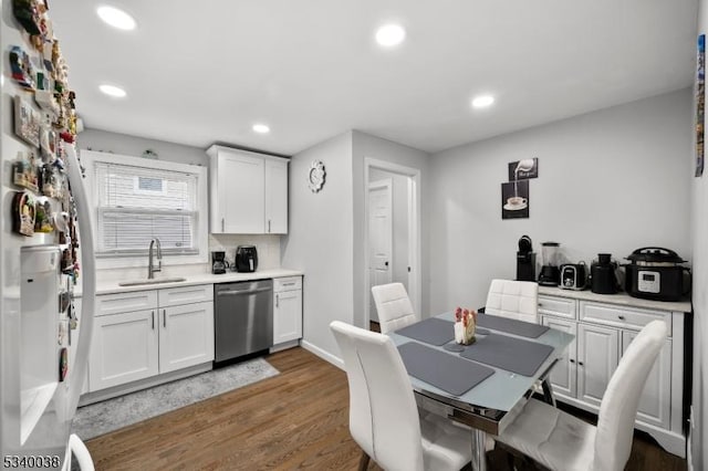 dining area featuring dark wood finished floors and recessed lighting