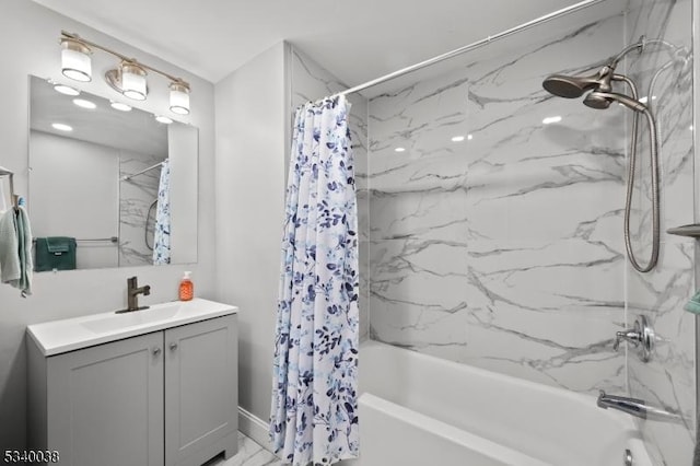 full bathroom featuring marble finish floor, vanity, and shower / bathtub combination with curtain