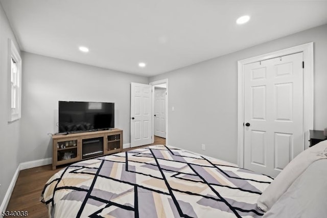 bedroom with recessed lighting, baseboards, and wood finished floors