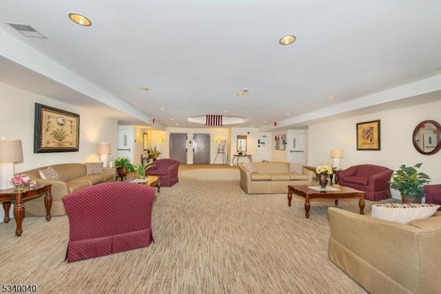 living room featuring recessed lighting, light carpet, and visible vents