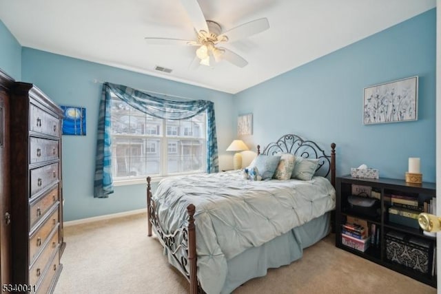 bedroom featuring visible vents, carpet floors, a ceiling fan, and baseboards