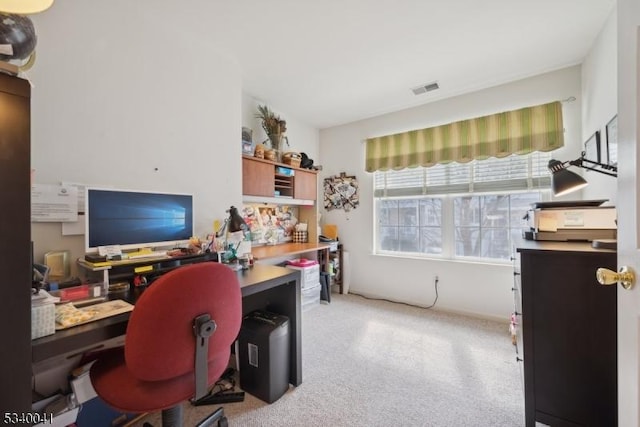 home office featuring visible vents and light carpet