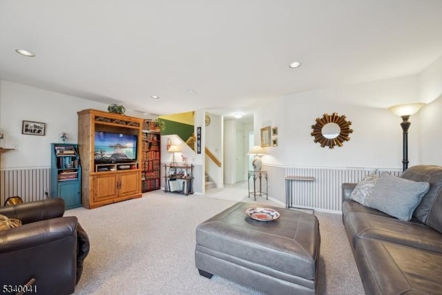 living area featuring carpet floors, recessed lighting, and stairway