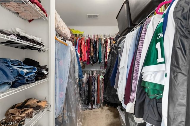 spacious closet with visible vents and carpet flooring