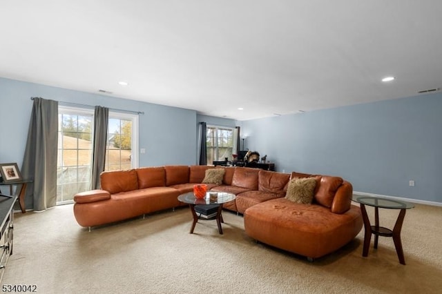 living room with light colored carpet, visible vents, baseboards, and recessed lighting