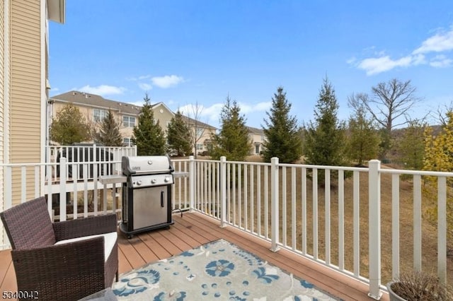 wooden terrace featuring grilling area