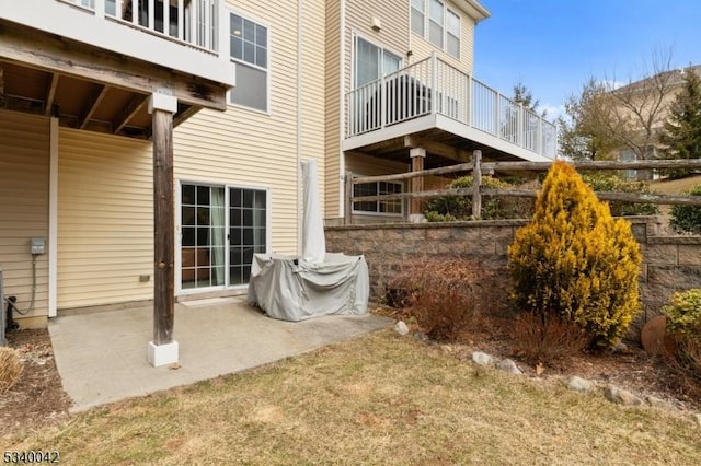 rear view of property featuring a patio area