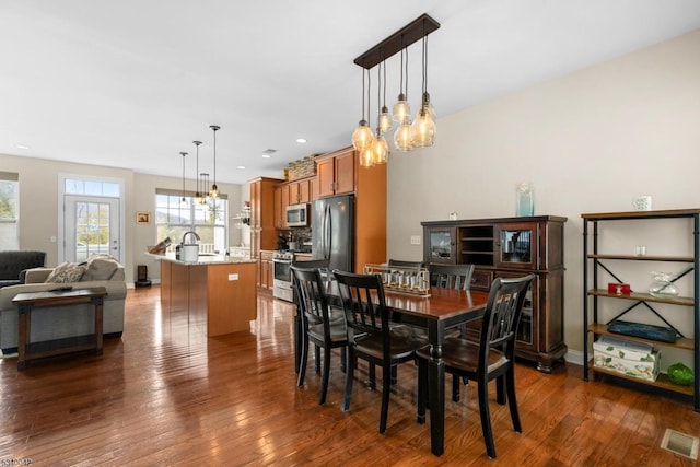 dining area with recessed lighting, visible vents, dark wood finished floors, and baseboards