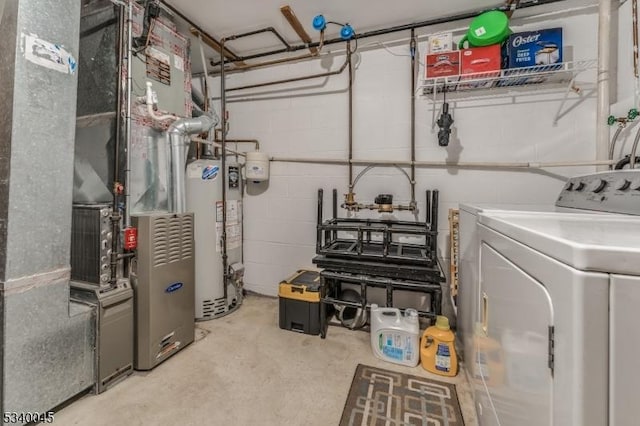 utility room featuring water heater, washing machine and clothes dryer, and heating unit