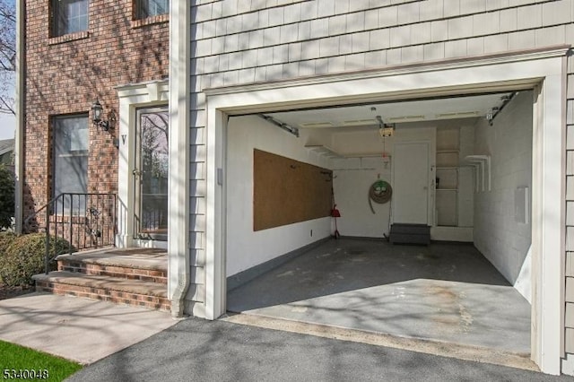 garage featuring driveway