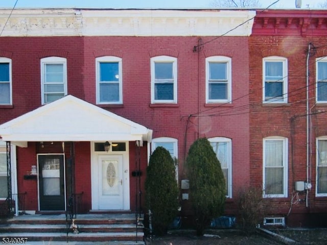 multi unit property with entry steps and brick siding