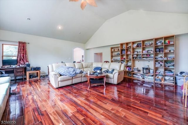 living room featuring high vaulted ceiling, arched walkways, ceiling fan, and wood finished floors