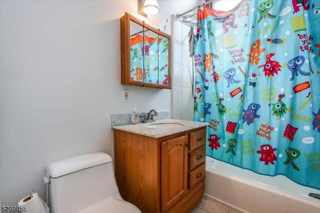 full bathroom with shower / bath combo with shower curtain, vanity, and tile patterned floors