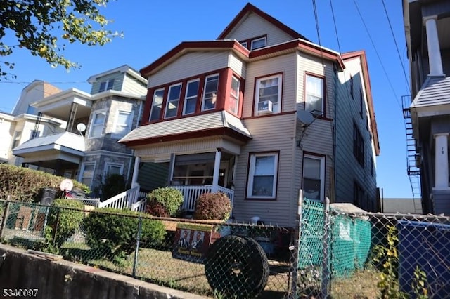 view of front facade with fence private yard