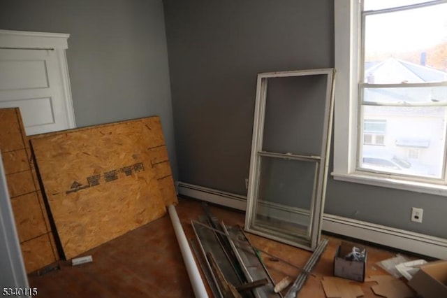 interior space with a baseboard radiator