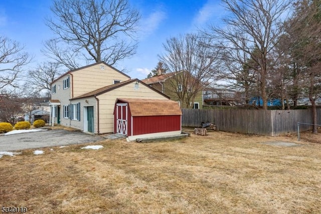 view of home's exterior featuring a yard and fence