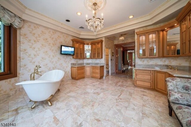 bathroom featuring a chandelier, a soaking tub, visible vents, and wallpapered walls